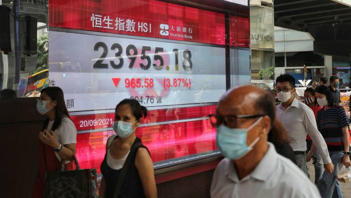 An electronic screen displays the Hang Seng Index in the Central district of Hong Kong