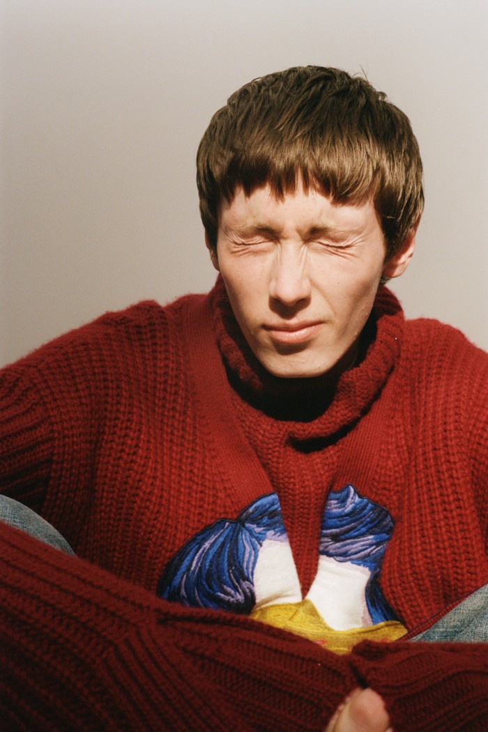 Fred wears Valentino x Undercover wool knit cardigan, £1,950, and wool knit jumper, £850