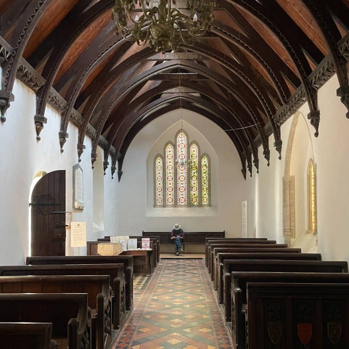 White walls and a dark oak roof in the hall of a medieval church 