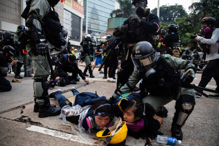 Riot police detain demonstrators during a protest in the Admiralty district of Hong Kong on Sunday September 29 2019  
