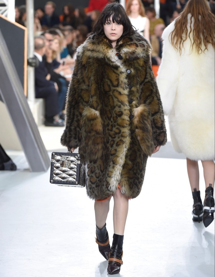 Louis Vuitton sheepskin coat, £8,838, calfskin boots, £1,110, and metal Boîte Promenade bag, £27,000