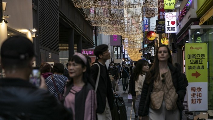 Pedestrians at the Myeongdong shopping district in Seoul