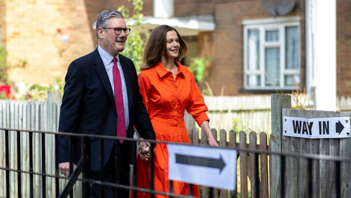 Keir Starmer and Victoria Starmer walking to a polling station
