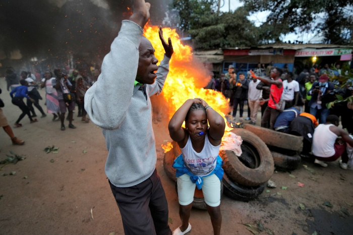 Supporters of defeated veteran opposition leader Raila Odinga burn tyres in the Kibera area of Nairobi