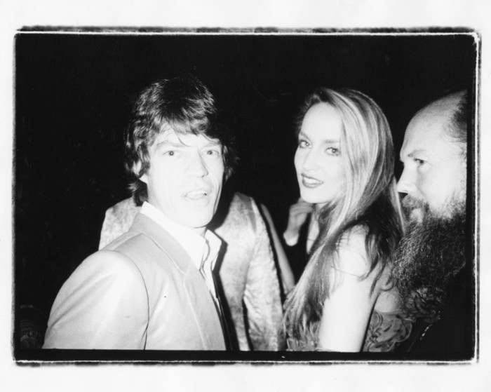 Mick Jagger, Jerry Hall, and Garech Browne, Red Ball, Paris, 1980, by Bob Colacello