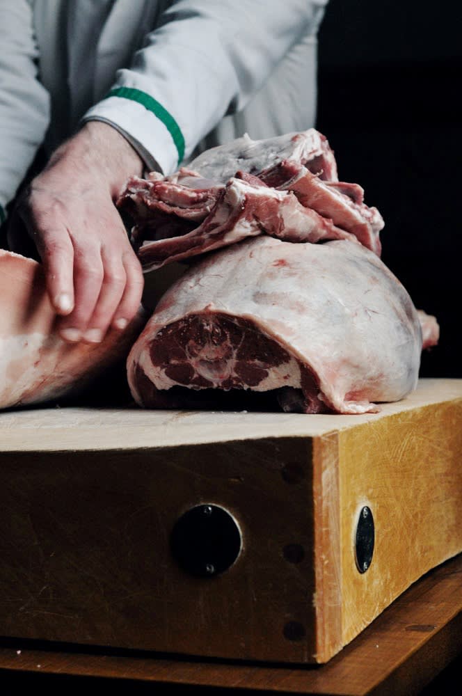 Local butcher John Malone preparing hill lamb, a regional speciality