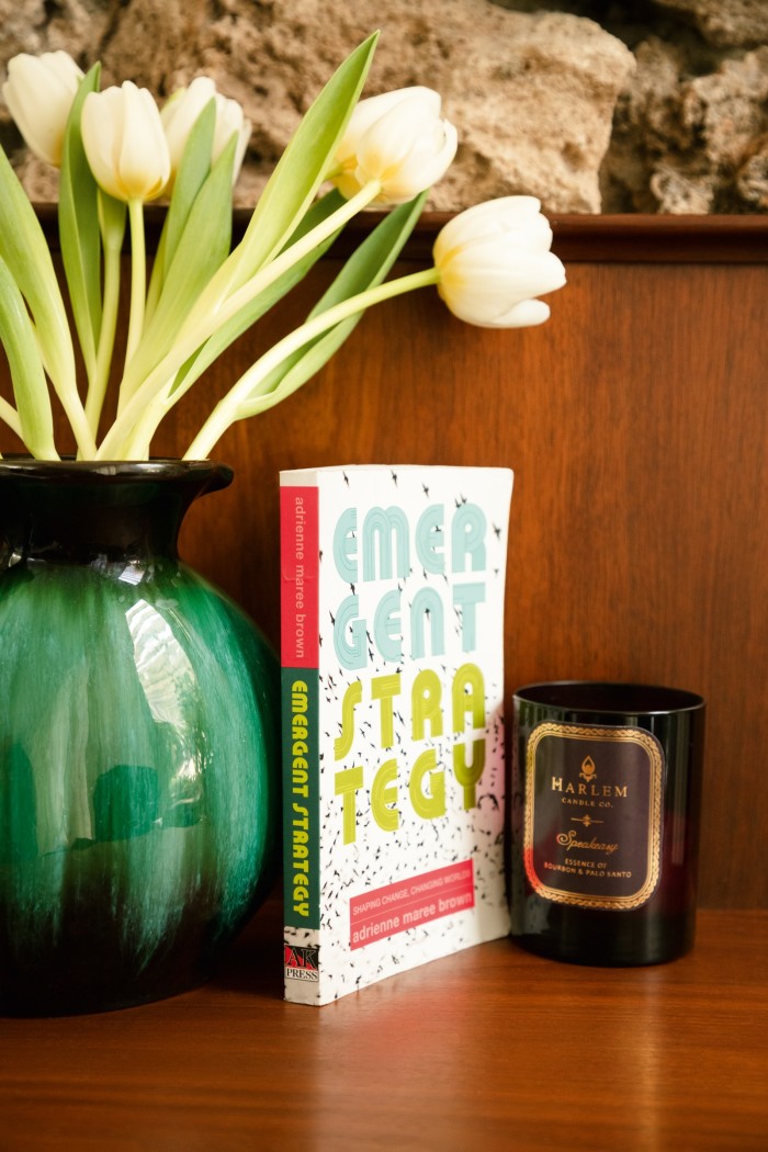 ‘Emergent Strategy’ by Adrienne Maree Brown – Welch’s favourite recent read – and a candle by the Harlem Candle Company