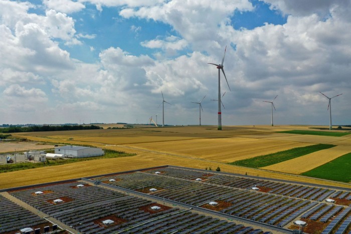 Solar panels near the hydrogen electrolysis plant at Energiepark Mainz in Germany, operated by Linde, left, in view of wind turbines. High costs and complexities have stunted previous efforts to create whole new economies centred around hydrogen