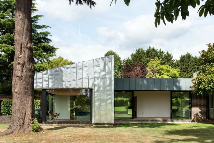 1960s-built Eashing House in Surrey has been reclad with insulating stainless steel, £2.5m, through The Modern House