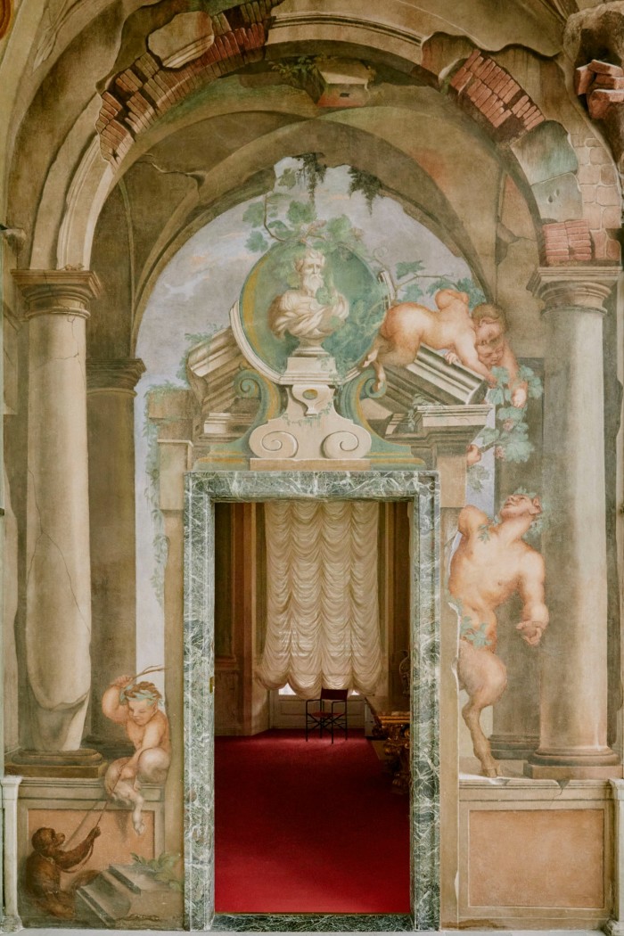 A trompe l’oeil-painted corridor in the Palazzo Rosso state museum