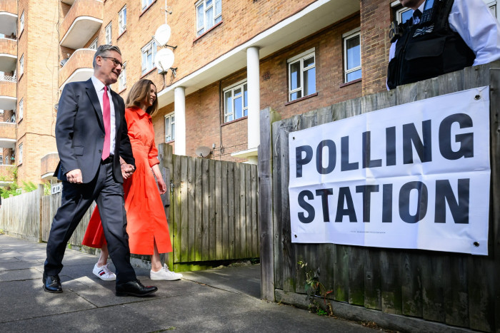 Sir Keir Starmer with his wife Victoria as they arrive at a polling station in Kentish Town, London