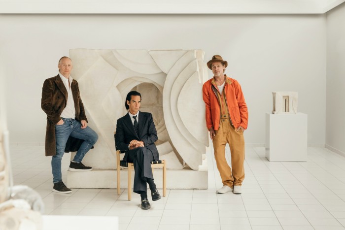 Thomas Houseago, Nick Cave and Brad Pitt in the exhibition space of WE at the Sara Hildén Art Museum, Tampere. Behind them is Houseago’s Untitled (Abstract IV), 2015