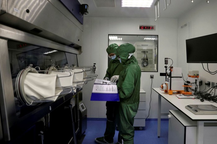 Lab technicians work on producing CAR-T cells and RNA in the laboratory for French biopharmaceutical company Cellectis in Paris last September