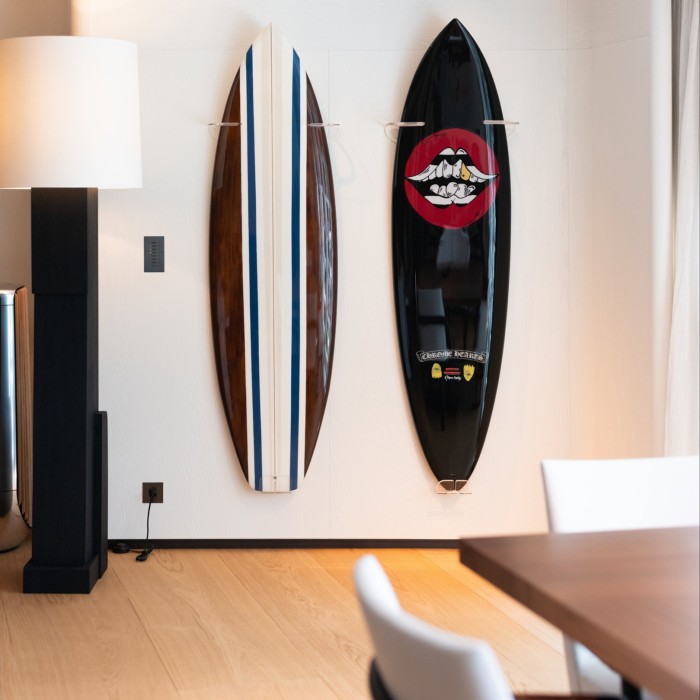 two surfboards hanging on a wall