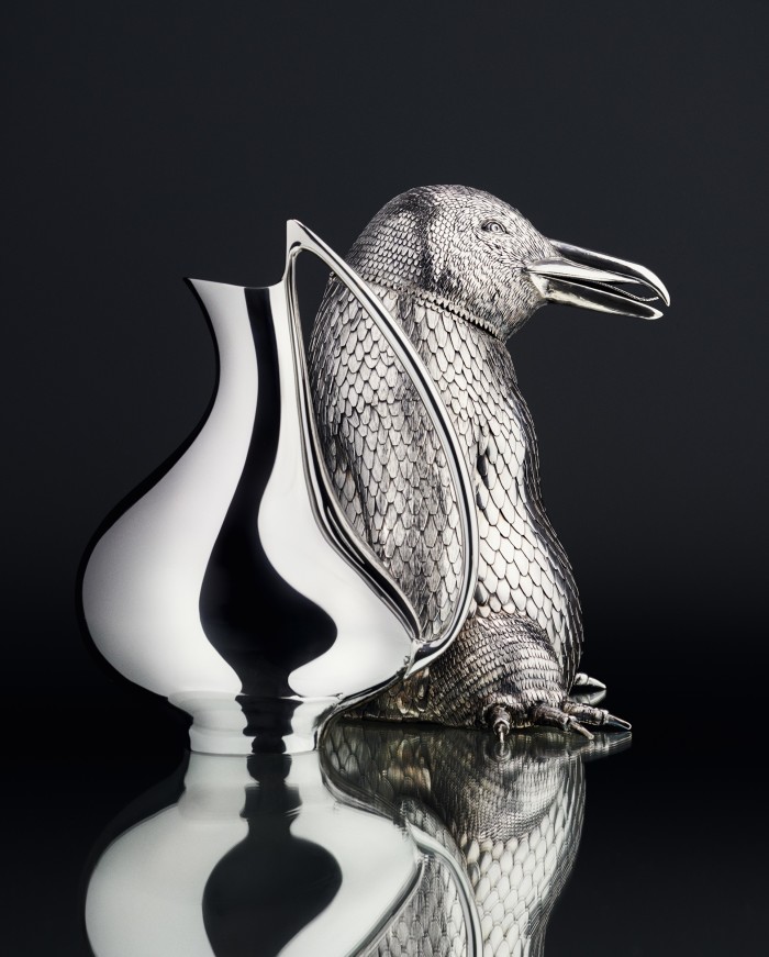 Georg Jensen silver pitcher Design #992 Pregnant Duck by Henning Koppel, £17,500. Fratelli Lisi silver penguin bottle holder, £14,630, artemest.com
