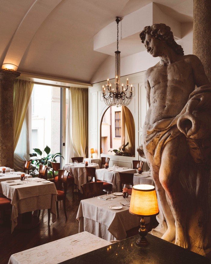 Boeucc’s main dining space, with vaulted ceiling, granite columns and marble statues