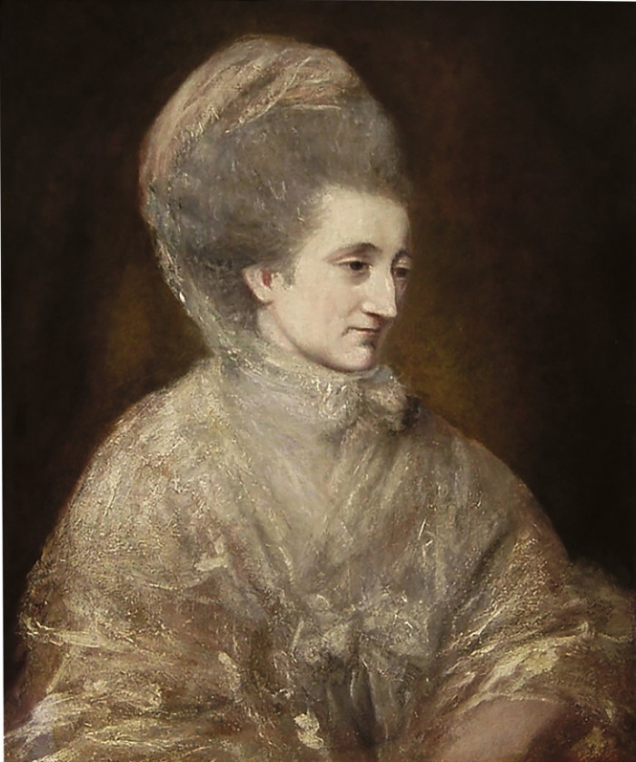 An oil painting of a woman in fine shawl and a lace headdress over her hair, which is styled high. She looks down to one side, thoughtfully 