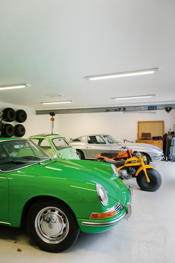 Mellor’s classic vehicle collection in his garage, including a 1966 Porsche, 1957 Isetta bubble car, 1960s Honda US90 trikes and a 1966 Corvette Stingray