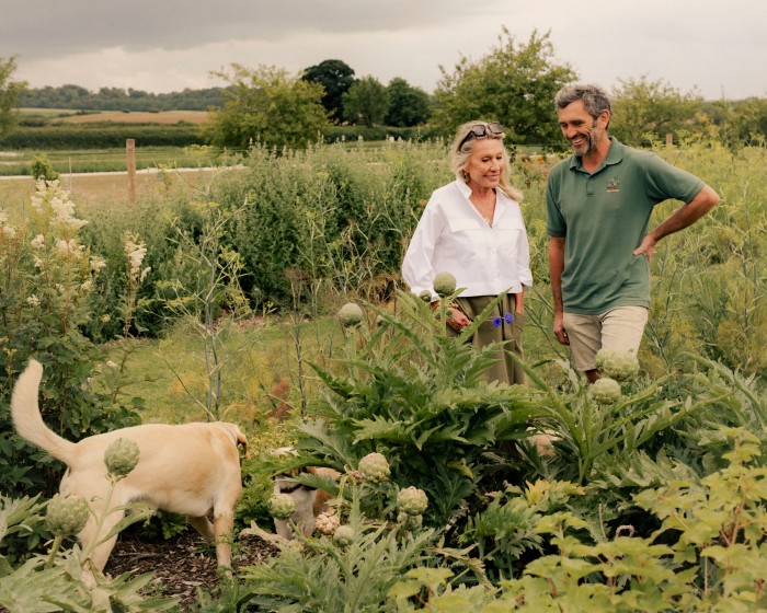 Bamford with Jez Taylor, head of the Daylesford market garden, and her dogs
