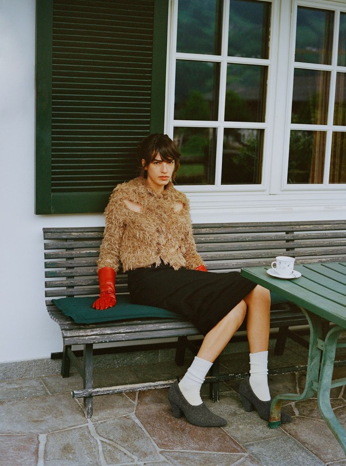 Esin wears Acne Studios wool knit jumper, £650. We11done wool, nylon and cashmere skirt, £1,000, and leather and cashmere shoes, £640. By Malene Birger sheep-leather gloves, £200. BaseRange wool socks, £30