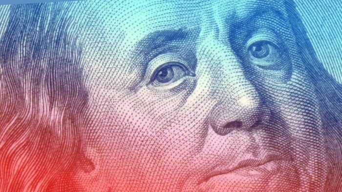 A close-up of Benjamin Franklin on the US$100 bill 