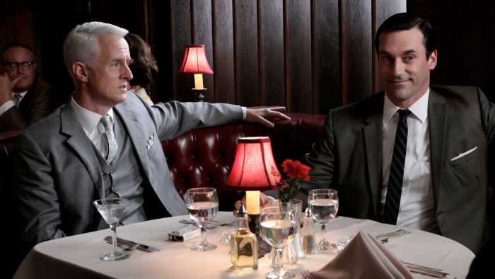 A scene from the television series ‘Mad Men’, showing two ad executives dining in a restaurant