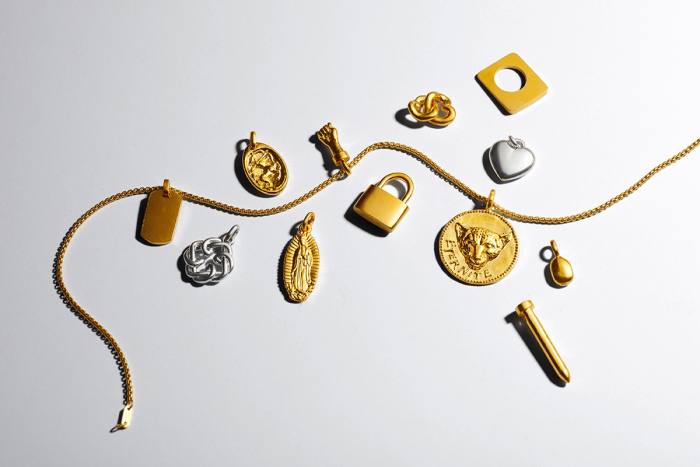 Mene gold and platinum charms, from $225, and gold chain, $1,799
