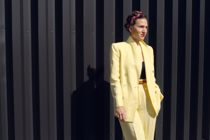 Francesca DiMattio at her studio in Hilldale, New York, wearing her yellow thrift store suit