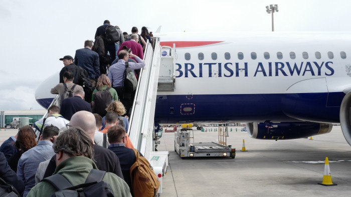 Passengers boarding a British Airways aircraft