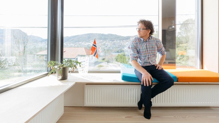 Henning Kongshavn Frønsdal sits by a panoramic window in Villa Sval
