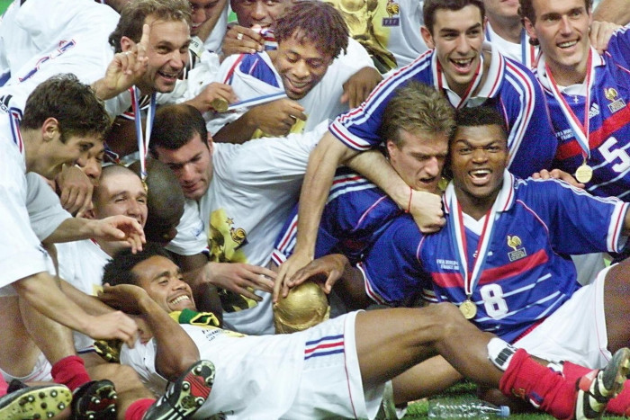 The French team celebrates after beating Brazil 3-0 in the 1998 World Cup final 