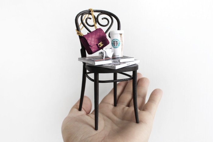 A Phillip Nuveen chair with Chanel bag and Starbucks cup