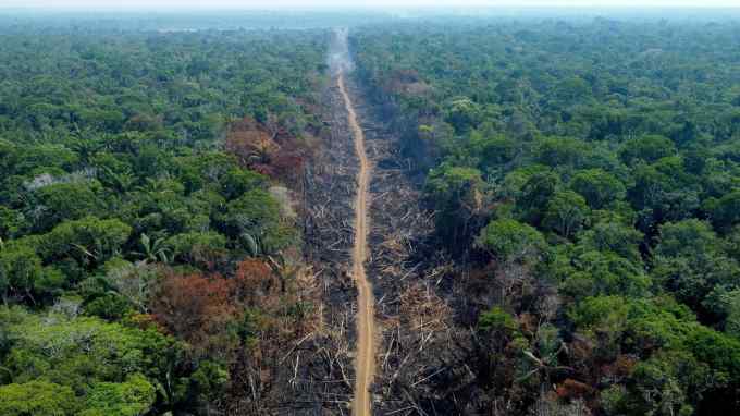 A deforested area of the Amazon seen from the air.  If the world cannot address climate change without the ecosystem services provided by certain countries, which nation is the debtor and which the creditor?