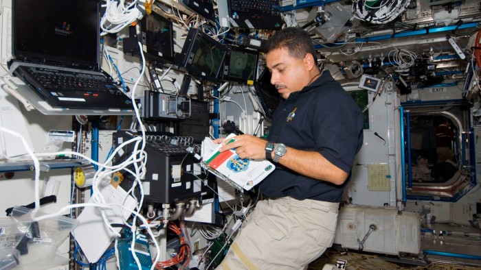 Nasa astronaut Jose Hernandez, STS-128 mission specialist, reads a procedures checklist in the Destiny laboratory of the International Space Station
