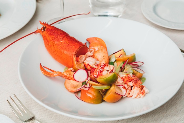 A plate of Catalan-style lobster on a table at Il Barettov