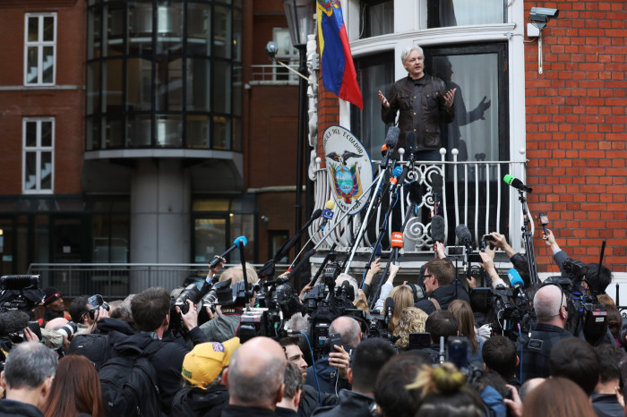Julian Assange speaks to media and supporters from a balcony at the Ecuadorian embassy in London in May 2017