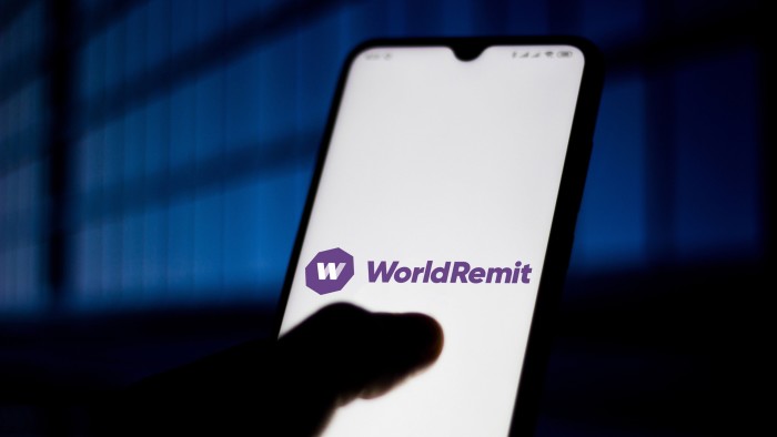 The WorldRemit logo displayed on a smartphone