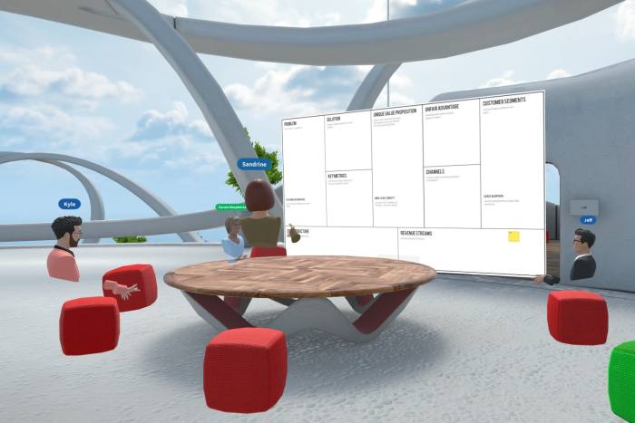 virtual meeting room with a whiteboard, round table, and red seats