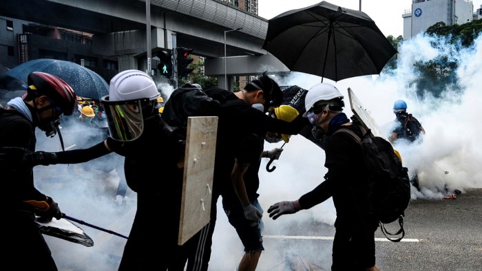 Hong Kong police fire tear gas during a demonstration in the district of Yuen Long, Hong Kong, in 2019