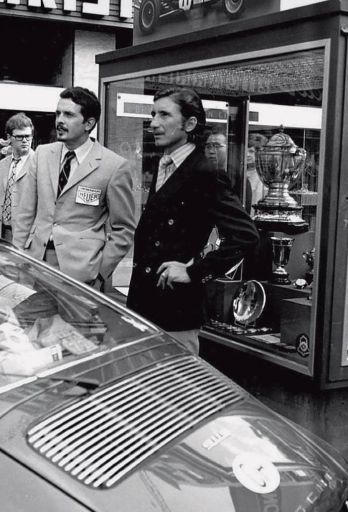 Famed watchmaker Gerd-Rüdiger Lang (left) – who then worked with Heuer – and Swiss driver Jo Siffert at the premiere of the film Le Mans in 1971