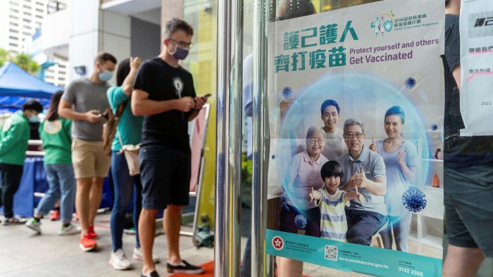 Patient patients: people line up in Hong Kong for BioNTech’s Covid-19 vaccine