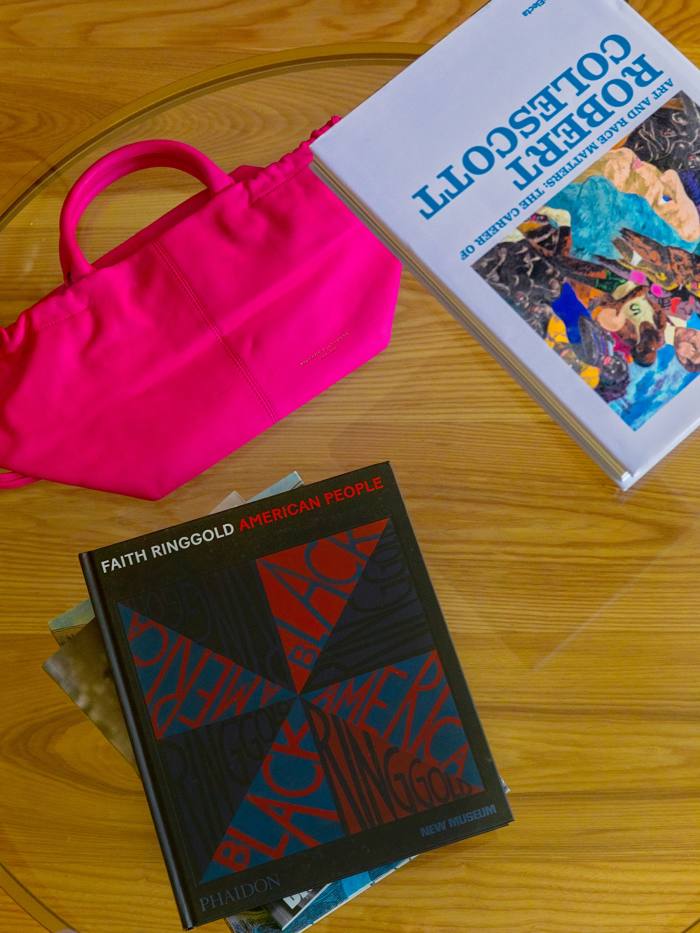 Self’s Brandon Blackwood bag and monographs about artists Robert Colescott and Faith Ringgold