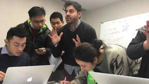 Sahil Chugani accepted onto programme at Cheung Kong Grad School of Business: pic shows: MBA crunchtime, business simulation module : managing virtual Chinese companies: Sahil Chugani is centre of pic with gesticulating hands!!!