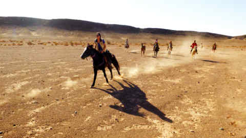 Saskia Burgess and companions on horseback in Morocco