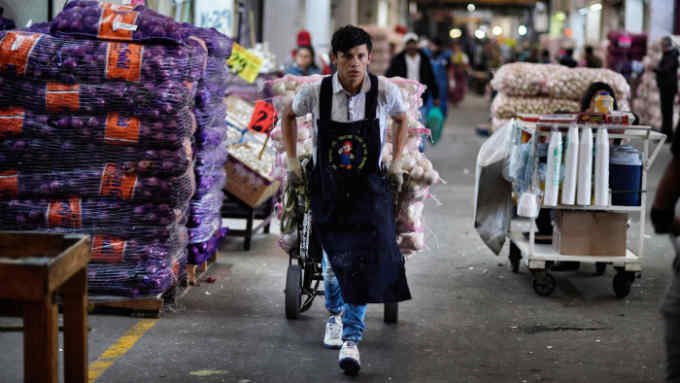 A man works at the &quot;Central de Abasto&quot; wholesale market in Mexico City on December 21, 2017. Some 500,000 people and 62,000 vehicles a day visit the Central de Abasto market on the east side of Mexico City to buy and sell avocados, tomatoes and about 15,000 other products. Roughly 35 percent of the flowers, fruits and vegetables produced in Mexico are purchased and distributed in its warehouses, and the 327-hectare market rivals the Rungis market in France and the Mercamadrid in Spain. / AFP PHOTO / ALFREDO ESTRELLA (Photo credit should read ALFREDO ESTRELLA/AFP via Getty Images)