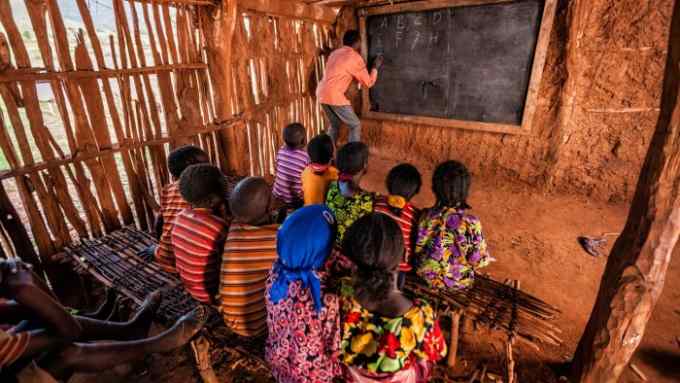 African children during english class in very remote school.