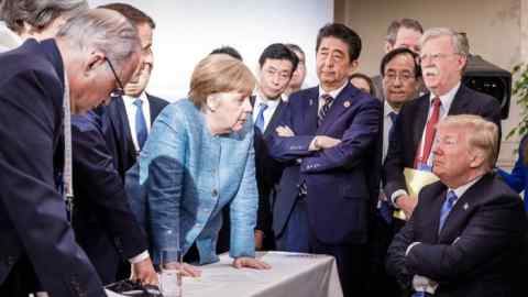 TOPSHOT - Photo released on Twitter by the German Governments spokesman Steffen Seibert on June 9, 2018 and taken by the German government's photographer Jesco Denzel shows US President Donald Trump (R) talking with German Chancellor Angela Merkel (C) and surrounded by other G7 leaders during a meeting of the G7 Summit in La Malbaie, Quebec, Canada. The photo went viral, popping up all over social media, sometimes in its original form sometimes altered for humorous or satirical ends. / AFP PHOTO / Bundesregierung / Jesco DENZEL / RESTRICTED TO EDITORIAL USE - MANDATORY CREDIT &quot;AFP PHOTO / BUNDESREGIERUNG / JESCO DENZEL - NO MARKETING NO ADVERTISING CAMPAIGNS - DISTRIBUTED AS A SERVICE TO CLIENTS JESCO DENZEL/AFP/Getty Images