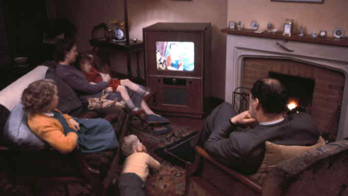 A family of five relax in front of their colour television. (Photo by Hulton Archive/Getty Images)