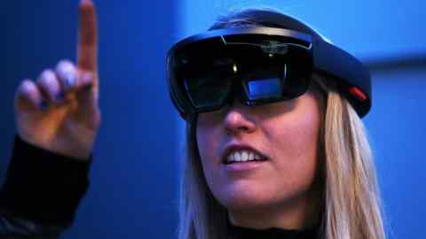 SAN FRANCISCO, CA - MARCH 30: Microsoft employee Gillian Pennington demonstrates the Microsoft HoloLens augmented reality (AR) viewer during the 2016 Microsoft Build Developer Conference on March 30, 2016 in San Francisco, California. The Microsoft Build Developer Conference runs through April 1. (Photo by Justin Sullivan/Getty Images)
