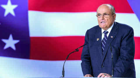 (FILES) In this file photo taken on July 13, 2019, former Mayor of New York City Rudy Giuliani speaks during a conference in Manza, Albania. - President Donald Trump's personal lawyer Rudy Giuliani returned to Ukraine on December 4, 2019, shrugging off the scandal over seeking dirt from Kiev on rival Democrats. The New York Times said Giuliani had traveled to Budapest on Tuesday and Kiev Wednesday to speak with former Ukrainian prosecutors who could have information that would support Trump's battle against impeachment. (Photo by Gent SHKULLAKU / AFP) (Photo by GENT SHKULLAKU/AFP via Getty Images)